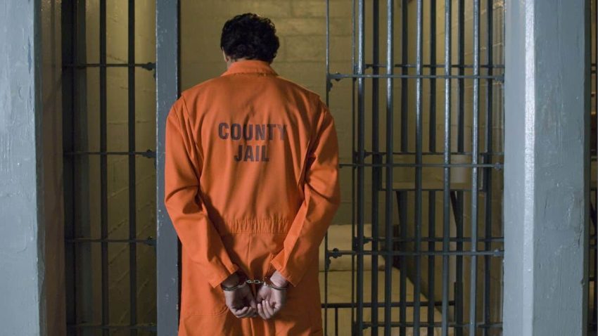 Handcuffed Prisoner In Jail